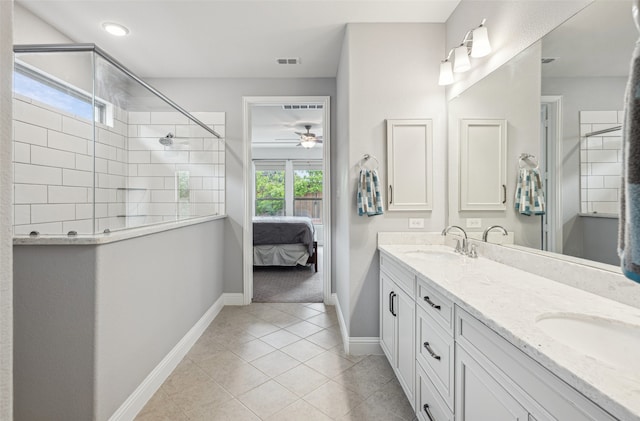 3004 Culver Ave, Celina, TX 75009 - ensuite bathroom featuring ceiling fan, a tile shower, double vanity, baseboards, and visible vents