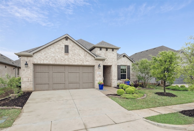 3004 Culver Ave, Celina, TX 75009 - french country style house featuring a shingled roof, a front lawn, brick siding, a garage, and concrete driveway