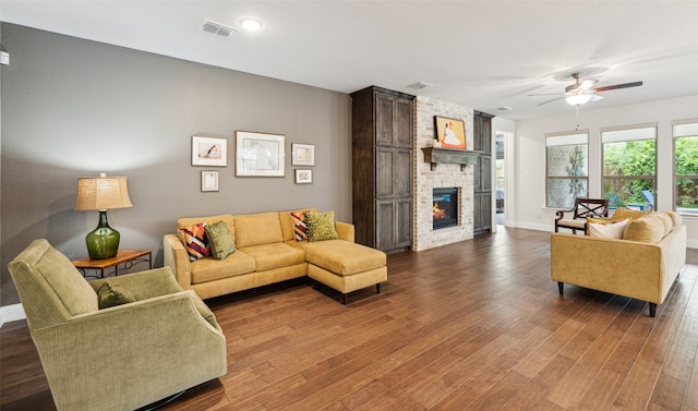 3004 Culver Ave, Celina, TX 75009 - living room with ceiling fan, visible vents, a fireplace, wood finished floors, and baseboards