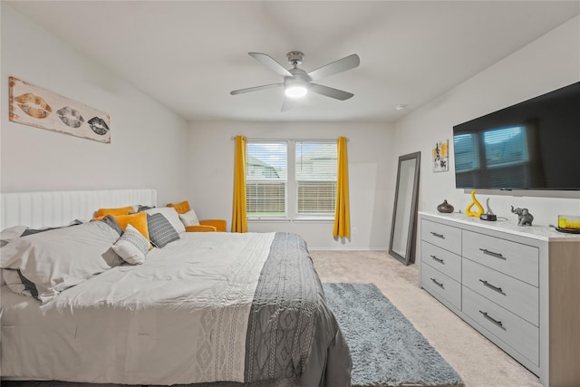 bedroom featuring a ceiling fan and light carpet