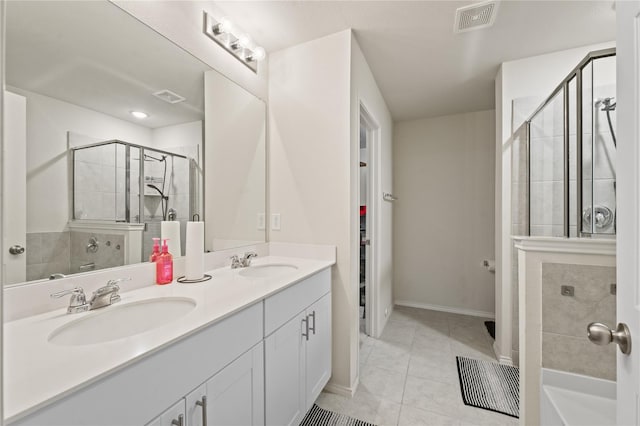 bathroom with double vanity, visible vents, a shower stall, and a sink