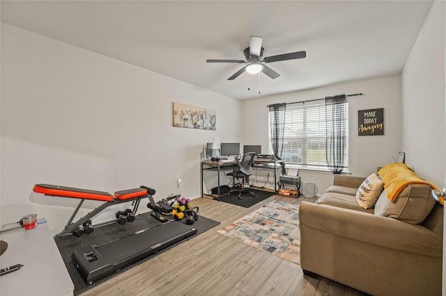 office area featuring a ceiling fan, baseboards, and wood finished floors
