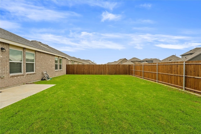view of yard featuring a fenced backyard and a patio