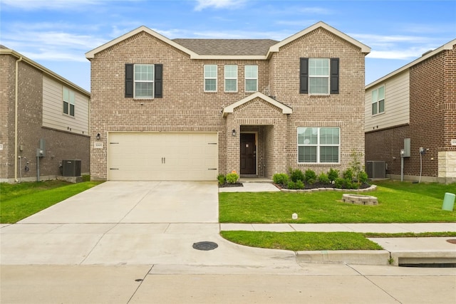 view of front of property featuring an attached garage, a front lawn, and brick siding
