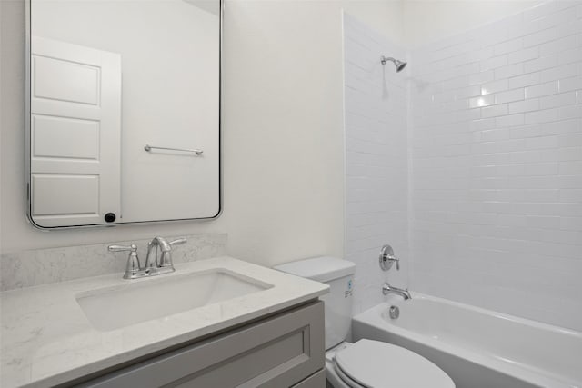 bathroom featuring vanity, toilet, and bathing tub / shower combination