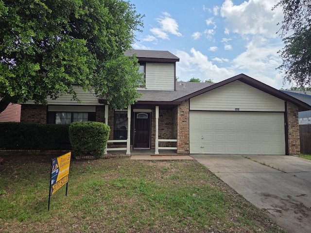 view of front of property featuring a shingled roof, an attached garage, brick siding, a front yard, and concrete driveway