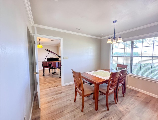 104 W Perry St, Frankston, TX 75763 - dining area with baseboards, an inviting chandelier, ornamental molding, and light wood finished floors