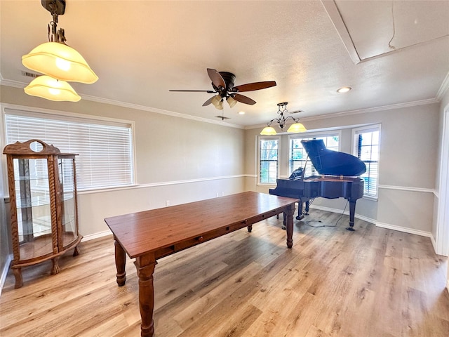 104 W Perry St, Frankston, TX 75763 - dining room with a ceiling fan, attic access, light wood-type flooring, baseboards, and ornamental molding