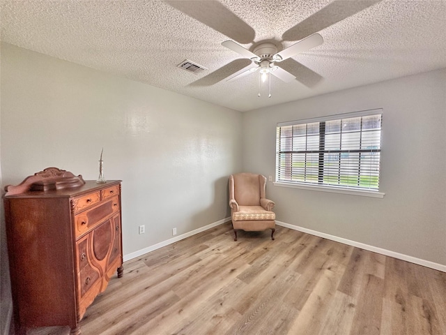 104 W Perry St, Frankston, TX 75763 - unfurnished room with ceiling fan, visible vents, baseboards, and light wood-style floors