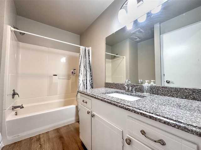 104 W Perry St, Frankston, TX 75763 - bathroom with vanity, wood finished floors, and shower / tub combo