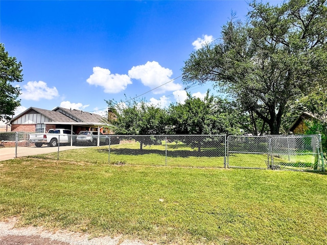 104 W Perry St, Frankston, TX 75763 - view of yard featuring fence, driveway, and a carport