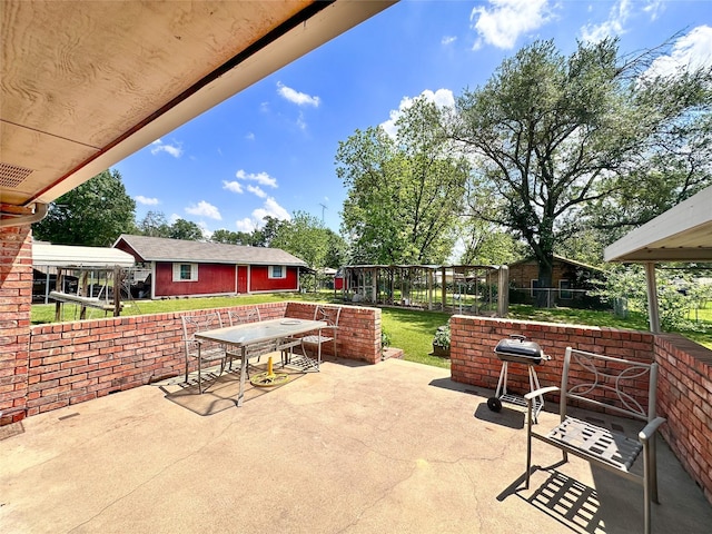 104 W Perry St, Frankston, TX 75763 - view of patio / terrace with an outdoor structure, outdoor dining area, and a fenced backyard
