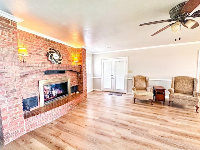 104 W Perry St, Frankston, TX 75763 - interior space featuring ornamental molding, a brick fireplace, wood finished floors, baseboards, and ceiling fan