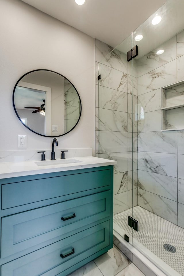 full bathroom with vanity, marble finish floor, recessed lighting, a shower stall, and a ceiling fan