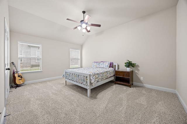 carpeted bedroom featuring baseboards, ceiling fan, and lofted ceiling