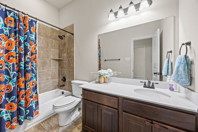 full bathroom featuring vanity, toilet, and shower / bath combo with shower curtain