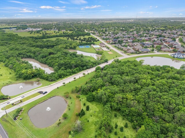 drone / aerial view with a residential view and a water view