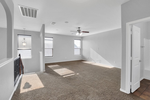 3317 Hornbeam St, Denton, TX 76226 - empty room with arched walkways, ceiling fan, visible vents, and baseboards
