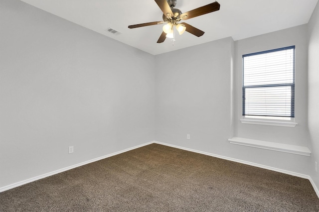 3317 Hornbeam St, Denton, TX 76226 - empty room featuring a ceiling fan, baseboards, visible vents, and dark carpet