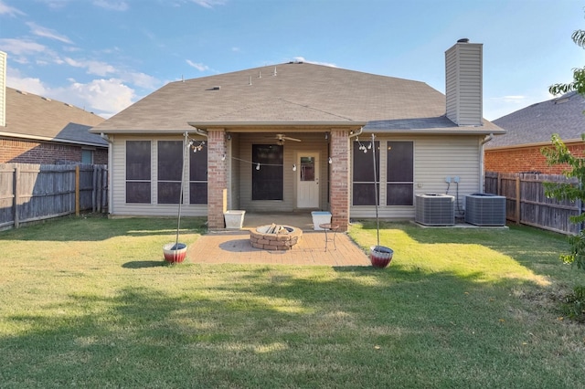 3317 Hornbeam St, Denton, TX 76226 - back of house featuring central air condition unit, a patio, a fenced backyard, and an outdoor fire pit