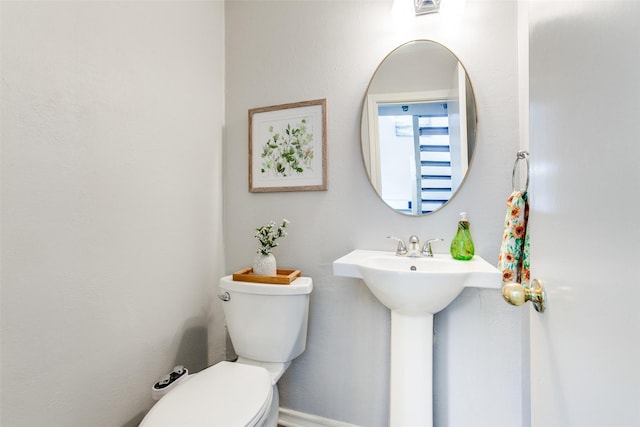 bathroom with visible vents and toilet
