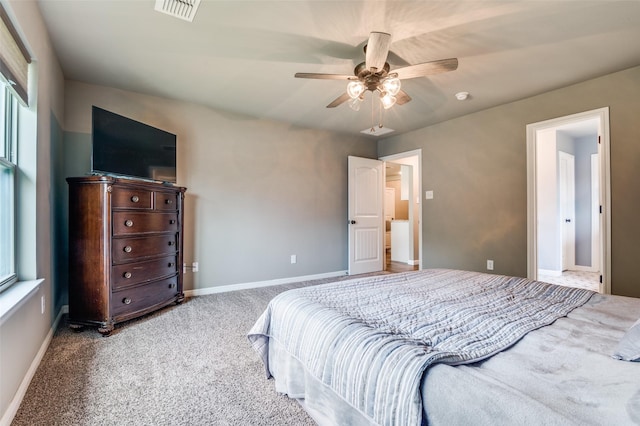 bedroom featuring a ceiling fan, baseboards, visible vents, and carpet