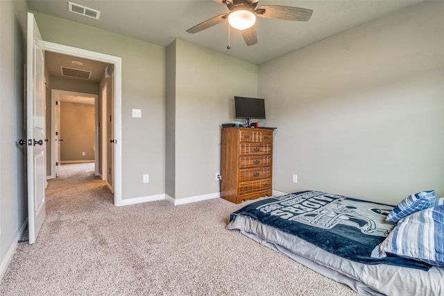 carpeted bedroom with baseboards, visible vents, and ceiling fan