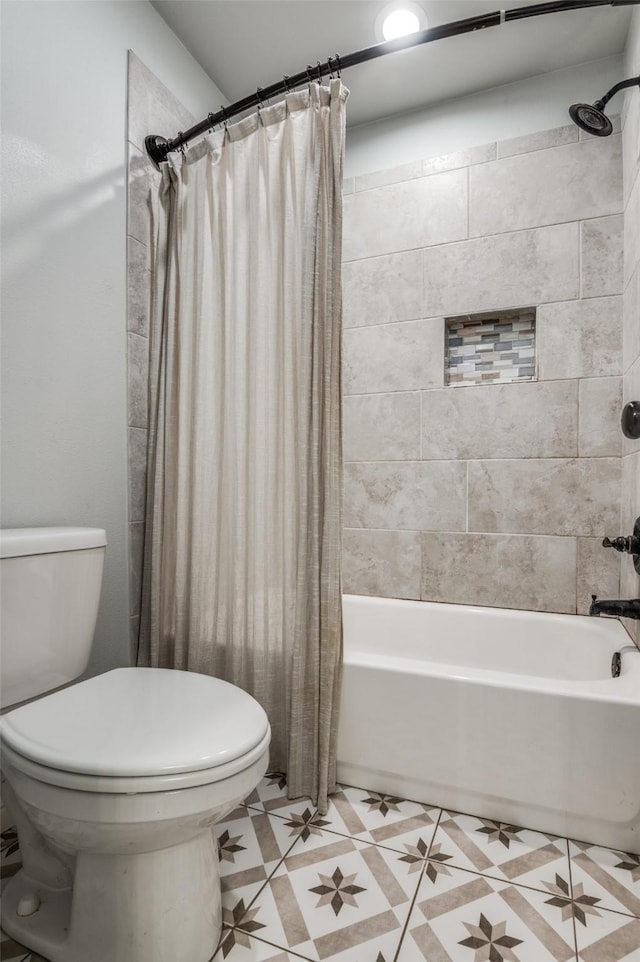 bathroom with shower / bathtub combination with curtain, tile patterned floors, and toilet