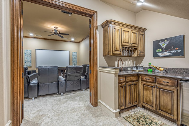 4230 Indian Creek Ln, Frisco, TX 75033 - kitchen featuring beverage cooler, light colored carpet, open floor plan, a sink, and crown molding