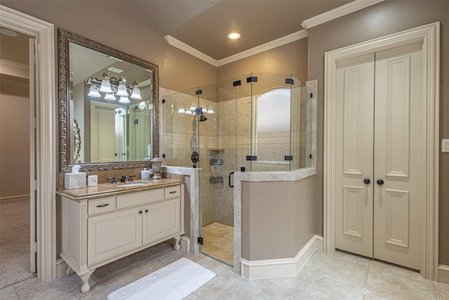 bathroom featuring vanity, baseboards, ornamental molding, and a stall shower