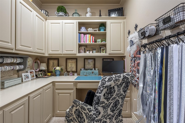 interior space with crown molding and built in study area