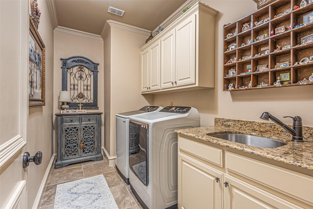 4230 Indian Creek Ln, Frisco, TX 75033 - laundry room with independent washer and dryer, cabinet space, ornamental molding, and baseboards