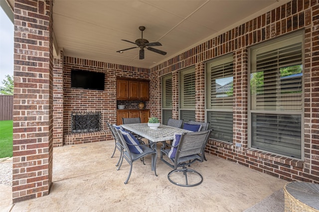 view of patio / terrace with area for grilling, ceiling fan, and outdoor dining area
