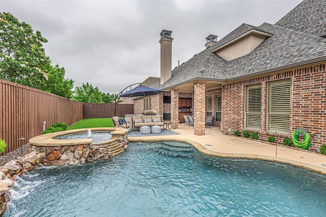4230 Indian Creek Ln, Frisco, TX 75033 - view of swimming pool featuring a fenced backyard, a pool with connected hot tub, a patio, and outdoor lounge area