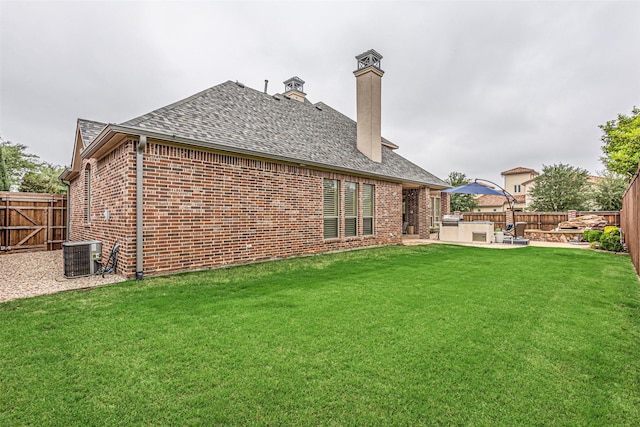 4230 Indian Creek Ln, Frisco, TX 75033 - back of house featuring brick siding, a patio, central air condition unit, and a chimney