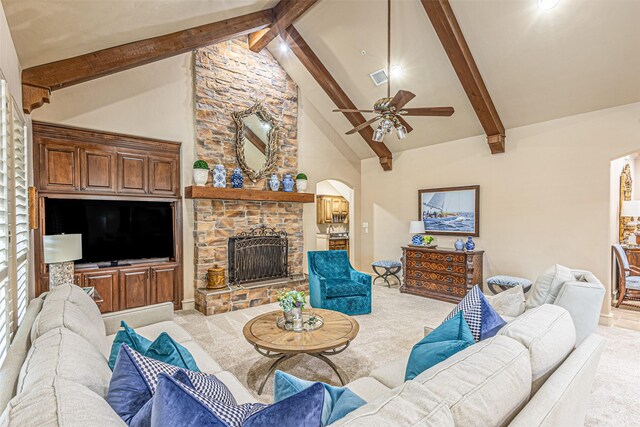 4230 Indian Creek Ln, Frisco, TX 75033 - living area with beam ceiling, arched walkways, high vaulted ceiling, a fireplace, and ceiling fan