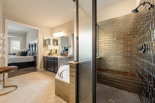 1005 Mallard Lakes Dr, Mckinney, TX 75072 - full bath with a stall shower, ensuite bath, a bath, tile patterned floors, and vanity