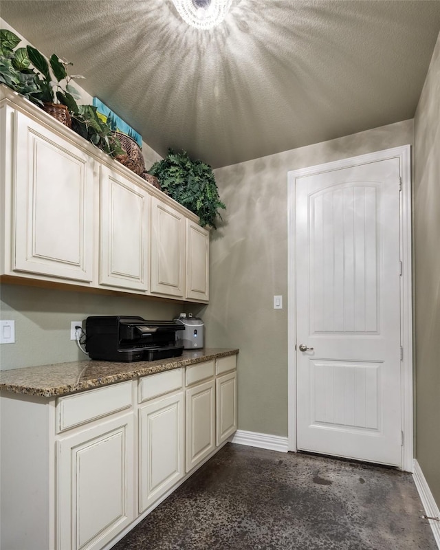 1005 Mallard Lakes Dr, Mckinney, TX 75072 - kitchen with concrete flooring and baseboards
