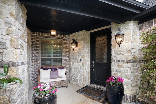 1005 Mallard Lakes Dr, Mckinney, TX 75072 - entrance to property featuring stone siding, covered porch, and brick siding