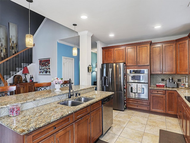 2420 Forest Gate Dr, Little Elm, TX 75068 - kitchen with a sink, appliances with stainless steel finishes, tasteful backsplash, ornamental molding, and pendant lighting