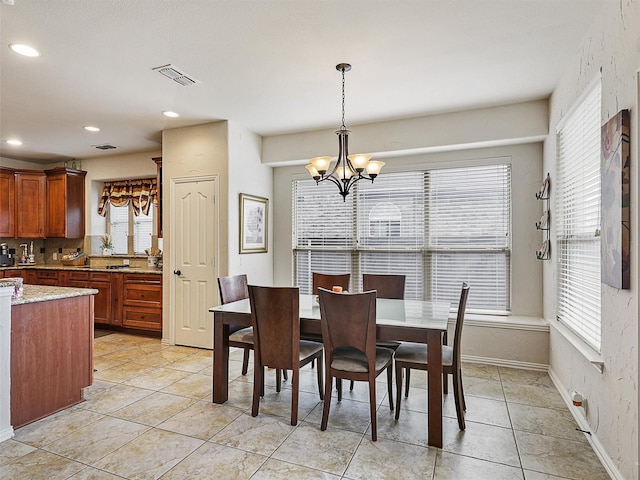 2420 Forest Gate Dr, Little Elm, TX 75068 - dining room featuring a chandelier, plenty of natural light, recessed lighting, and light tile patterned flooring