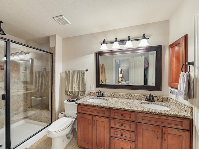 2420 Forest Gate Dr, Little Elm, TX 75068 - full bathroom featuring toilet, double vanity, and a stall shower
