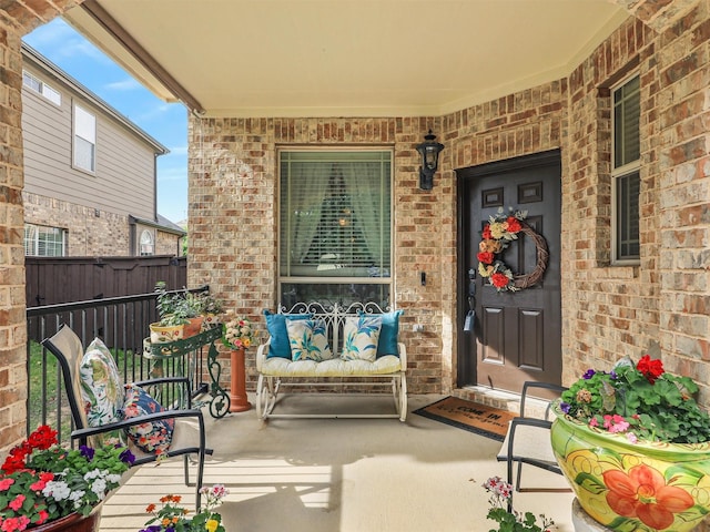 2420 Forest Gate Dr, Little Elm, TX 75068 - property entrance featuring brick siding, a porch, and fence