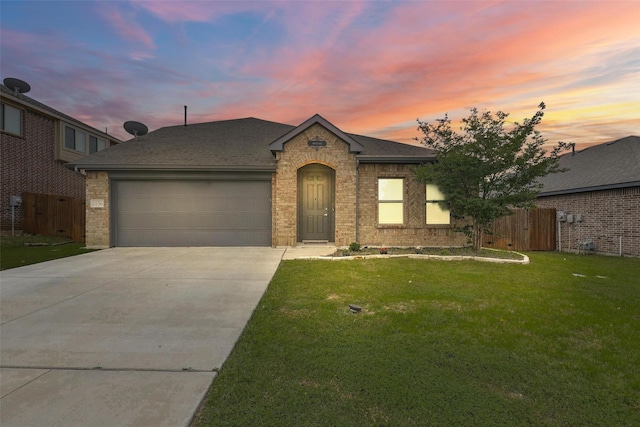 1036 Fairfax Dr, Godley, TX 76044 - view of front of home with a garage, driveway, brick siding, and a shingled roof