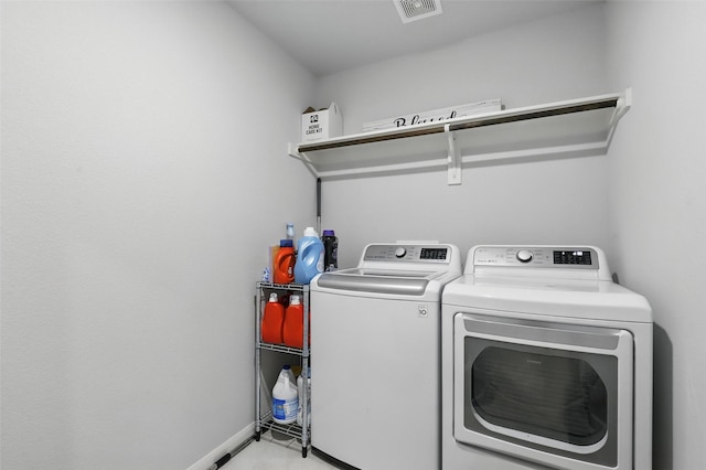 1036 Fairfax Dr, Godley, TX 76044 - laundry room with washing machine and clothes dryer and baseboards