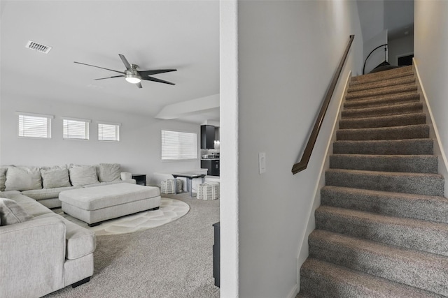 1036 Fairfax Dr, Godley, TX 76044 - carpeted living room with ceiling fan and stairway