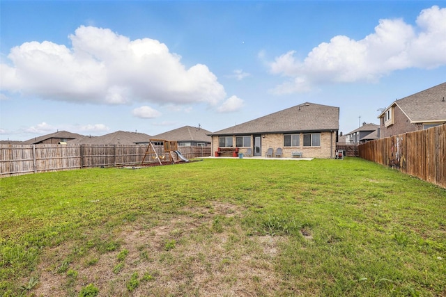 1036 Fairfax Dr, Godley, TX 76044 - back of house featuring a patio, a playground, and brick siding
