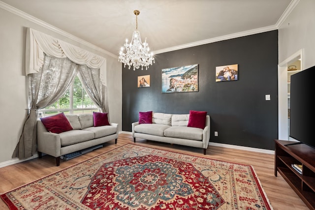living area with crown molding, wood finished floors, and a notable chandelier