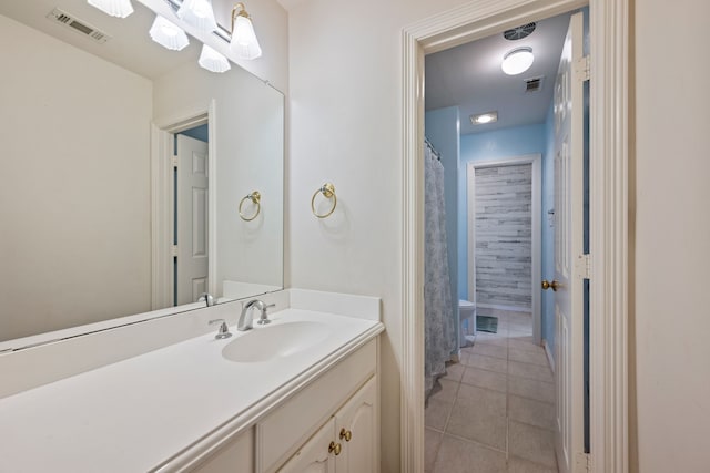 full bathroom with visible vents, tile patterned flooring, toilet, and vanity