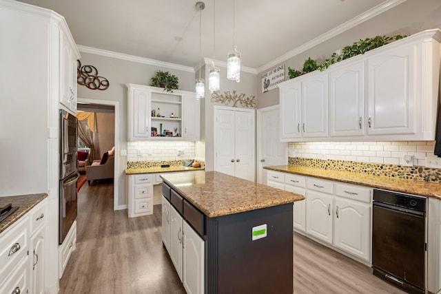 kitchen with white cabinets, open shelves, light wood-style flooring, and a center island